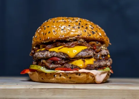 Double beef patty burger with melted cheese on a sesame bun