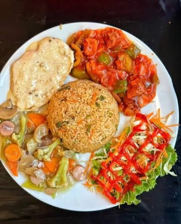 Fried rice with omelette, stewed tomato and mixed vegetables